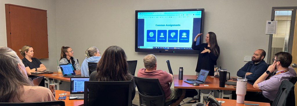 Janey, a Skill Surge Consultant, explaining a concept to a group of teachers with her hands in the air.